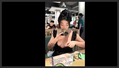 Horny girl showing off boobs at a restaurant
