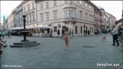 A woman strips down on the street to test the reactions of those around her